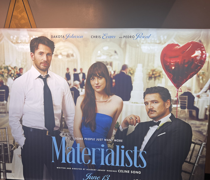 poster inside movie theater for Materialists